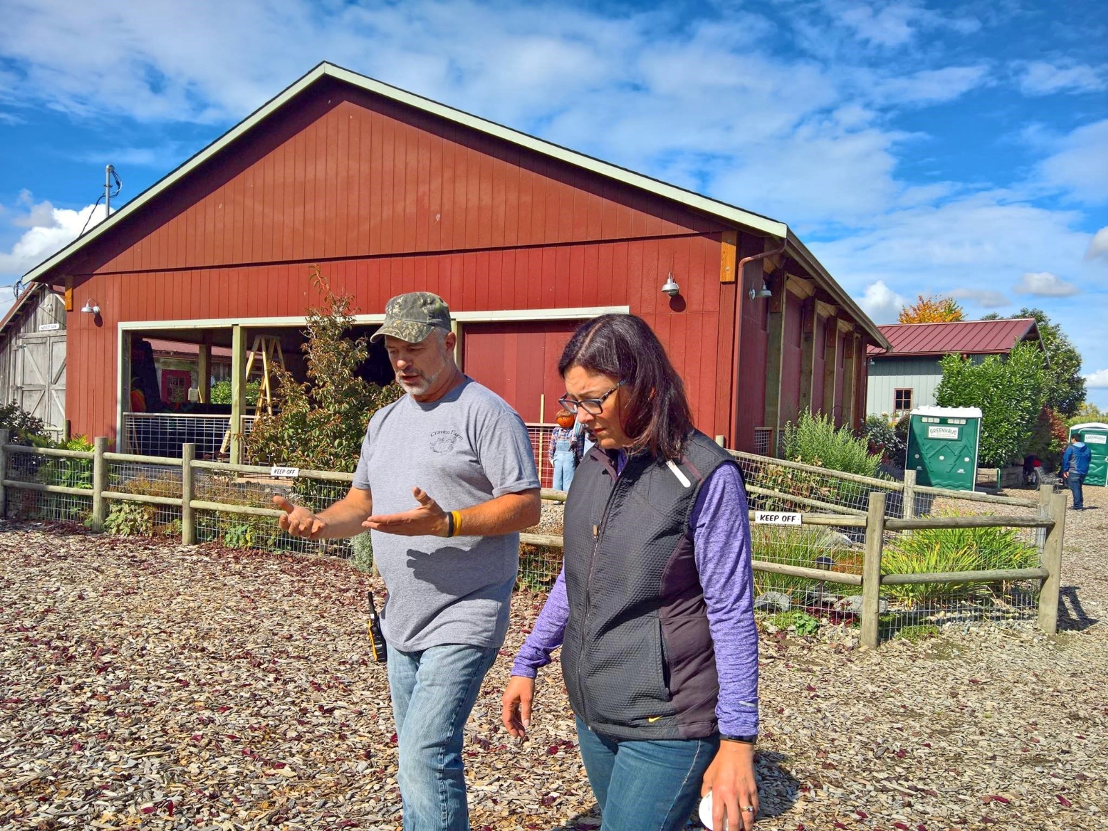 Rep. Suzan DelBene walking through a farm